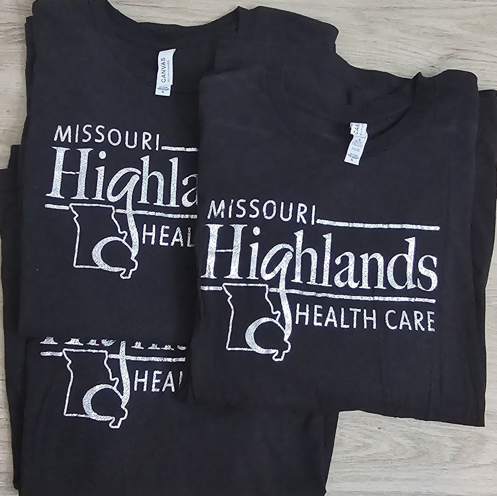 Black Missouri Highlands Health Care Tee With Glitter Logo.